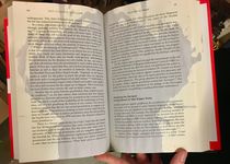 Wine poured on one of the books